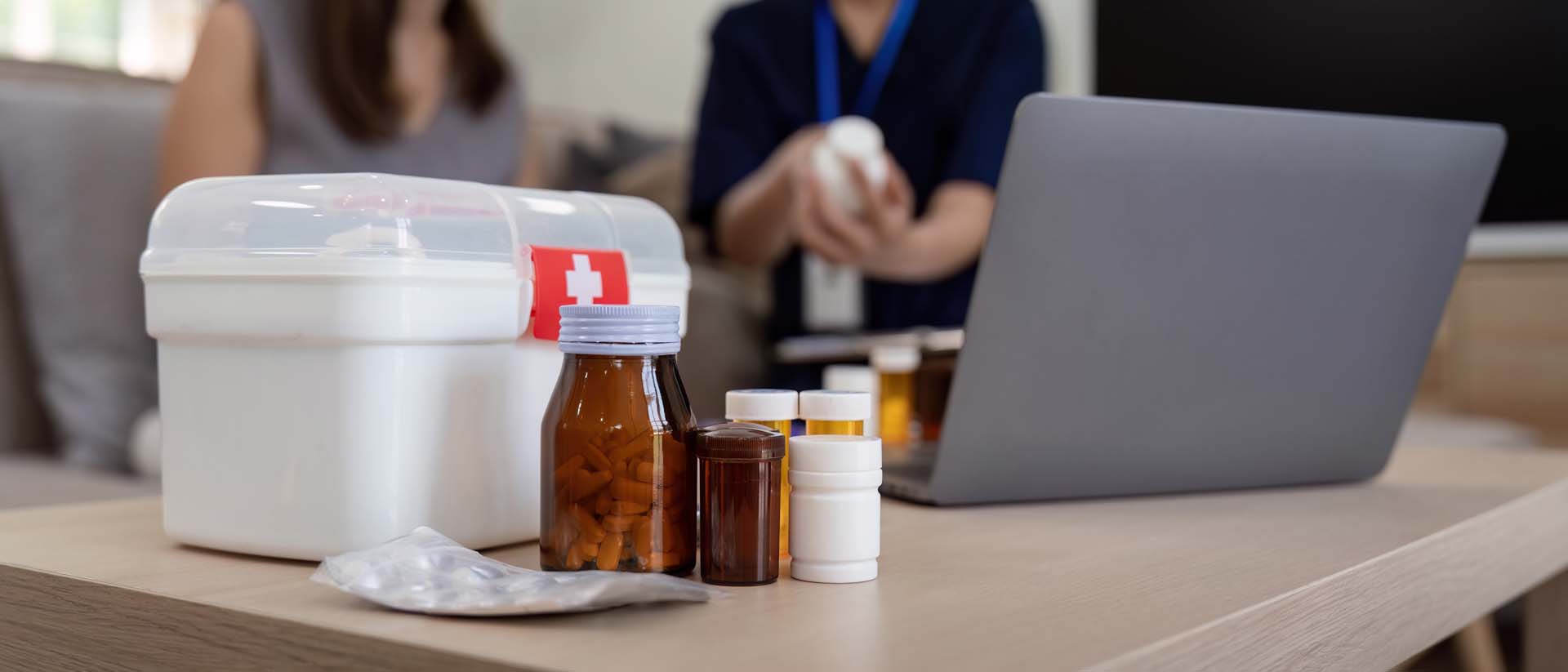 Caregiver explaining medication to a client